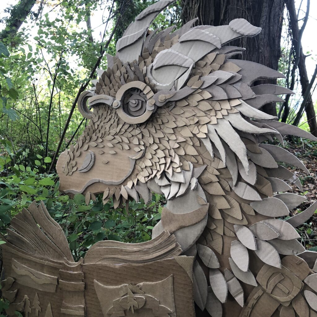 photo of dragon made of scrap cardboard